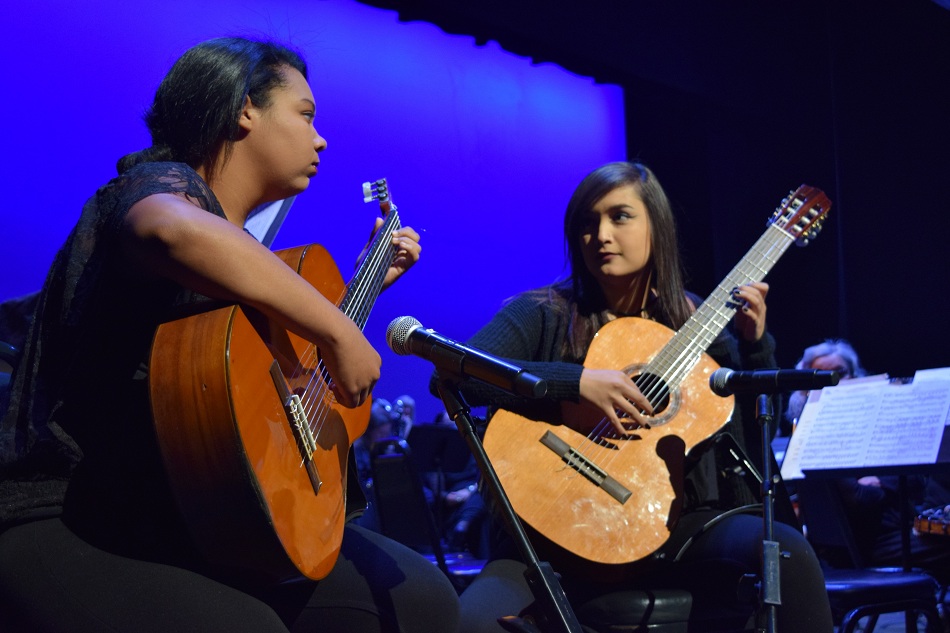 Kayla Harrell (left) and Alyssa Salas (right) of La Mirada High, winners of the Blanche Nissim Memorial Competition, perform a guitar duet at the La Mirada Theater of the Performing Arts on April 19.