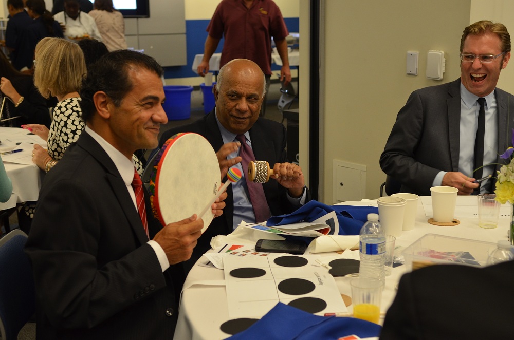 Downey public works director Mohammad Mostahkami, finance director Anil Gandhy and space center executive director Ben Dickow participate in a group activity at Friday's State of the Schools event. Photo courtesy DUSD