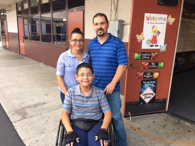 Los Nietos eighth-grader Jared Avalos with his mother, Nora, and his father, Sergio. Jared has excelled in the MESA program and beyond despite a neurological condition that makes walking difficult.