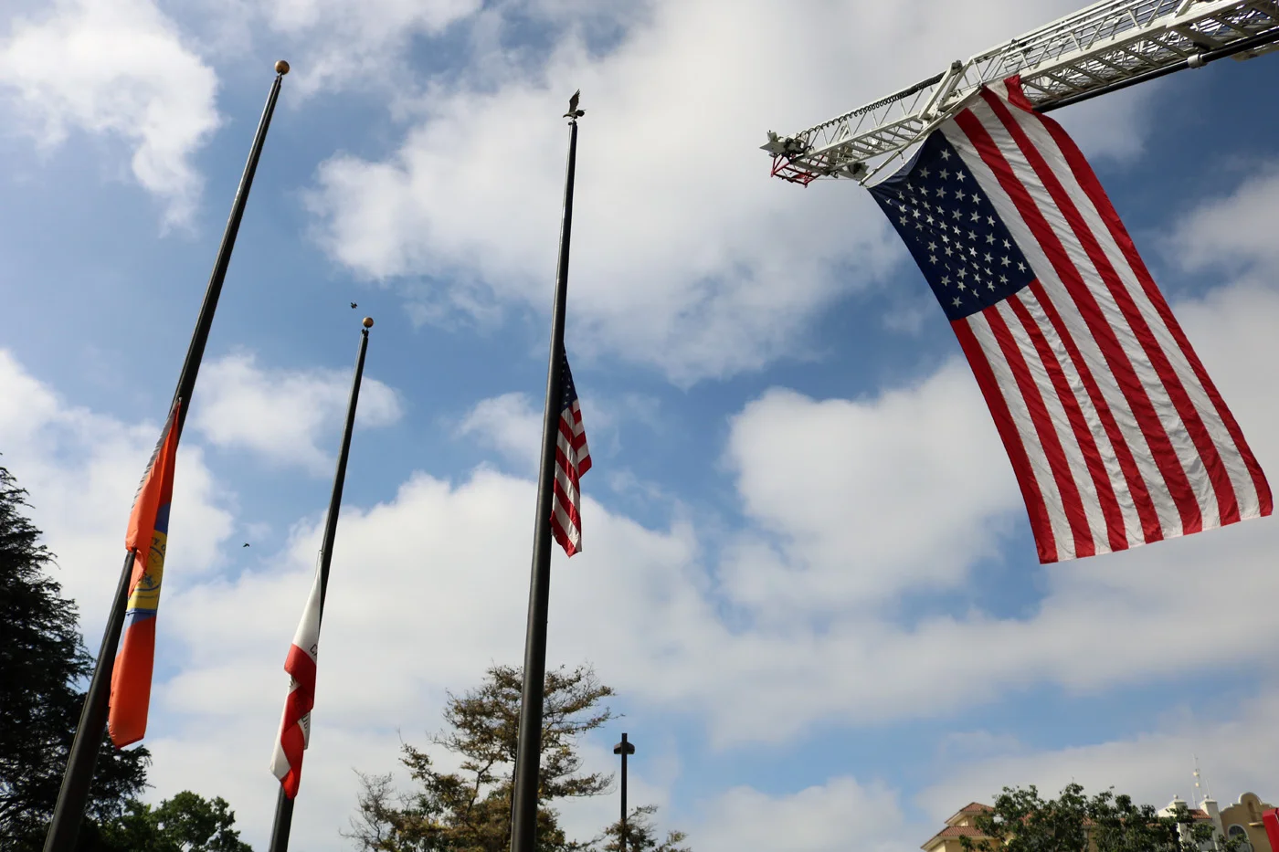 The American flag flies at a 9/11 ceremony in Downey. Photo by Alex Dominguez