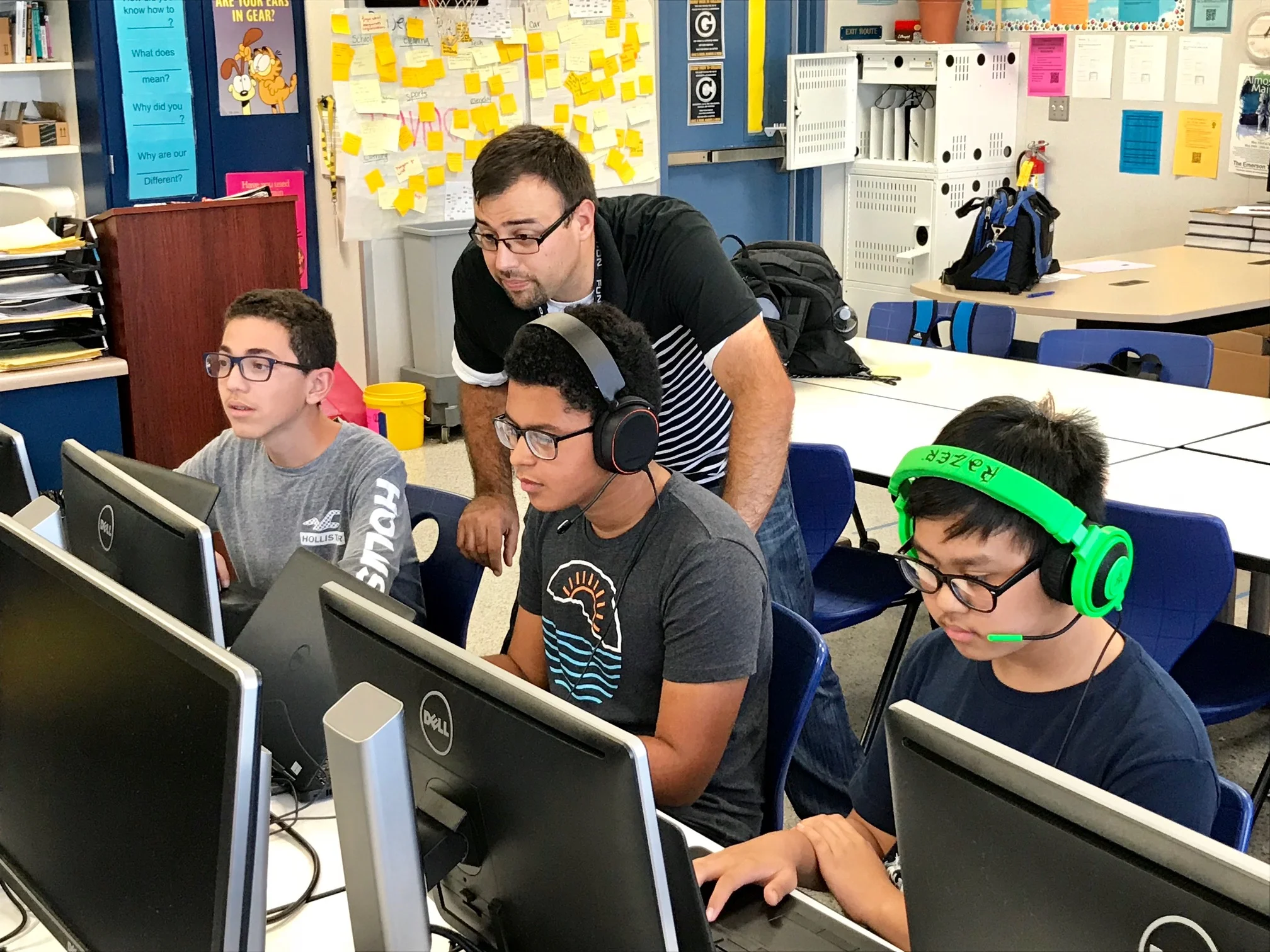 David Quintero, a math, computer science, and engineering teacher at Warren High School, oversees a participating eSports team practicing before the program officially kicks off on Wednesday, Oct. 10.