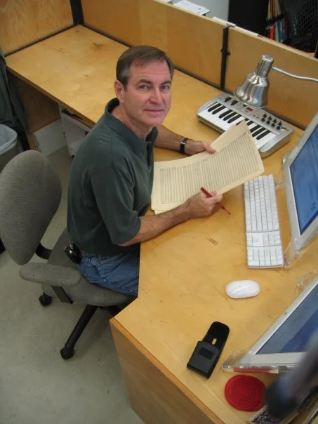 Lars Clutterham at his desk at JoAnn Kane Music Service.