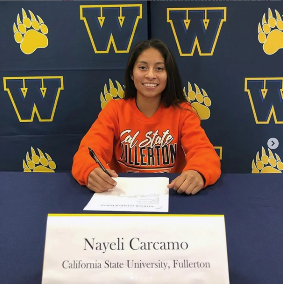 Warren High senior Nayeli Carcamo will play soccer for Cal State Fullerton after signing a letter of intent last week. The signing ceremony was attended by Nayeli’s coaches and teammates. Photo courtesy Warren High soccer.