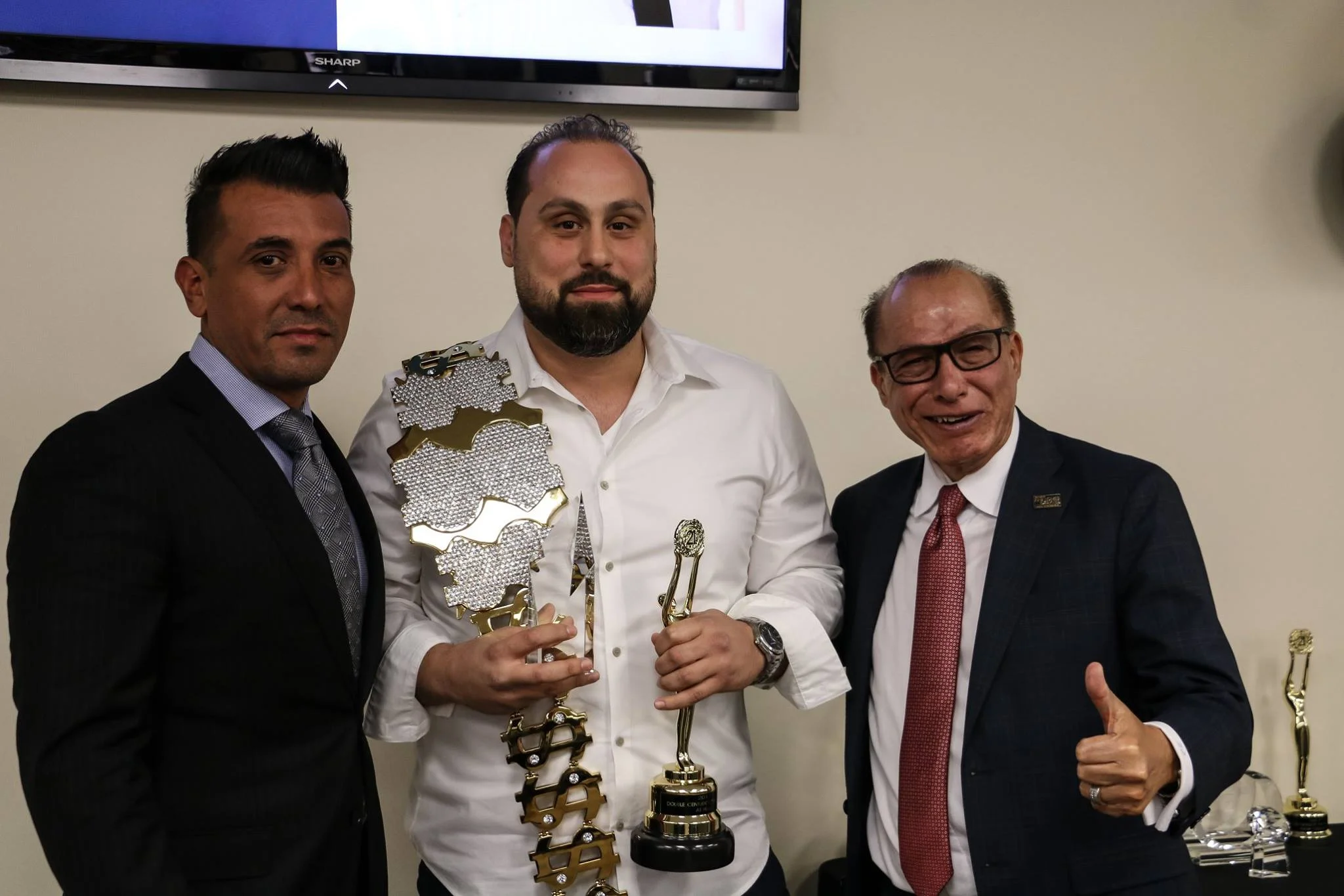 Ali Hijazi, center, earned Century 21’s Grand Centurion Producer Award. Photo courtesy Century 21 A Better Service Realty.