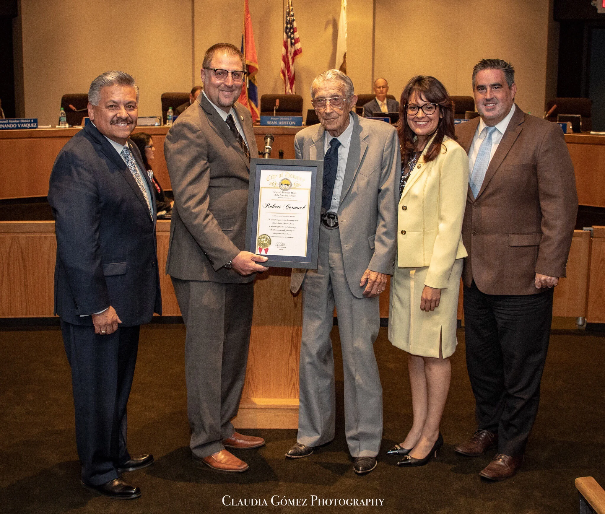 Robert Cormack, center, was honored at a Downey City Council meeting in 2018. Photo by Claudia Gomez.