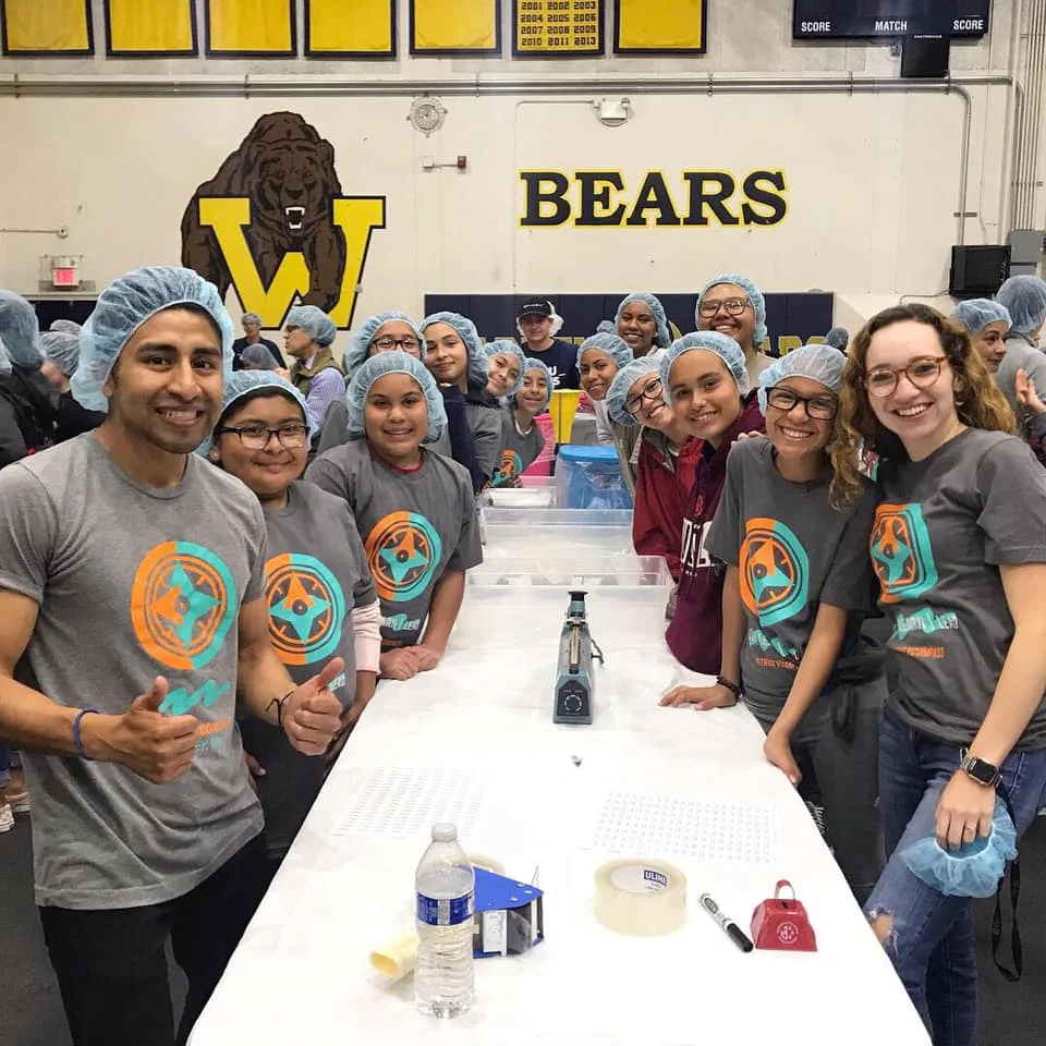 Volunteers package 62K meals for local hungry families