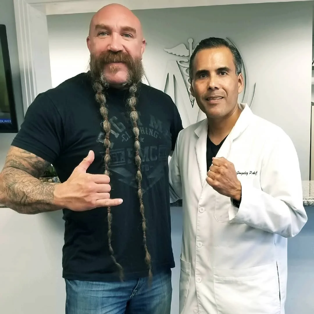 Ray Gonzalez, right, with MMA referee Mike Beltran.