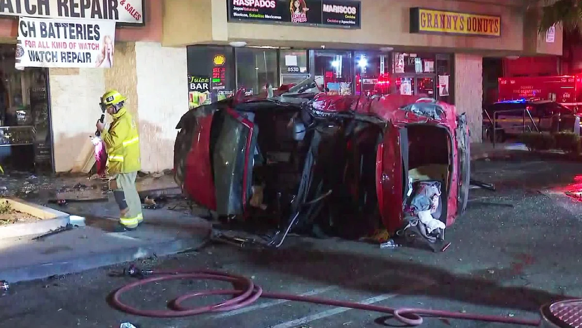 Downey police officers rescue two people after crash