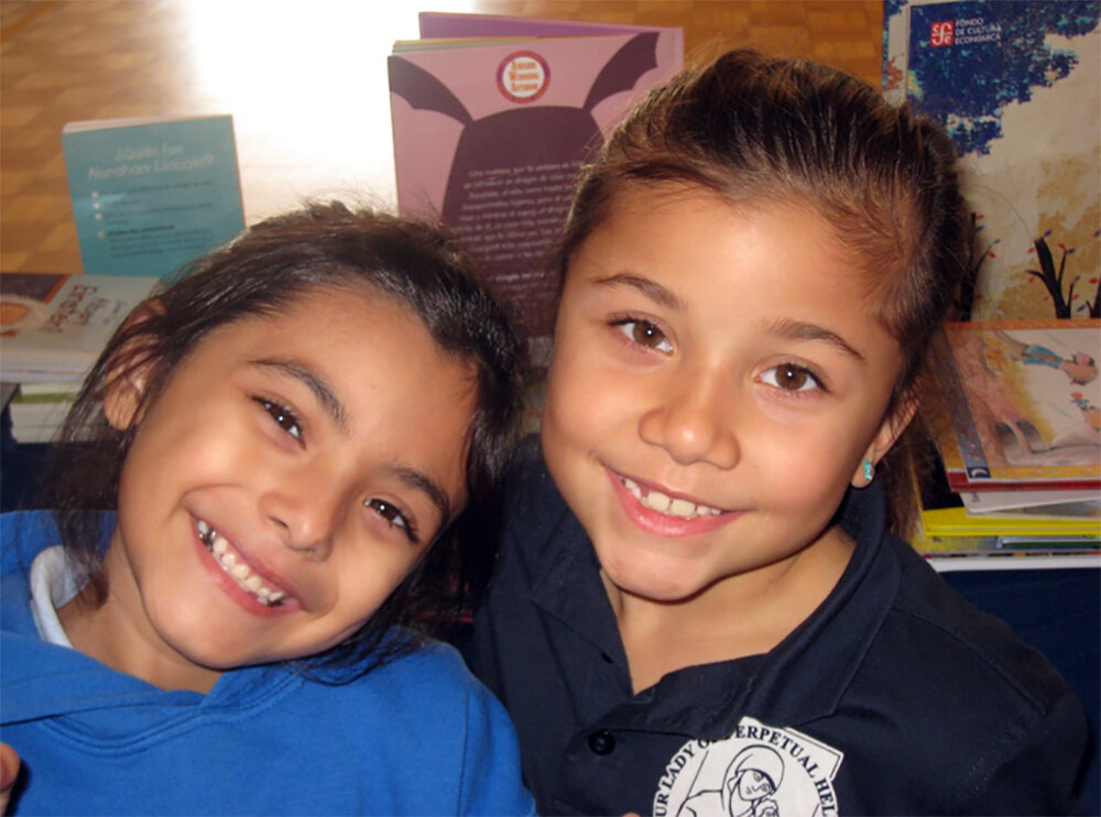 Downey Rotary uses grant to purchase books for OLPH students