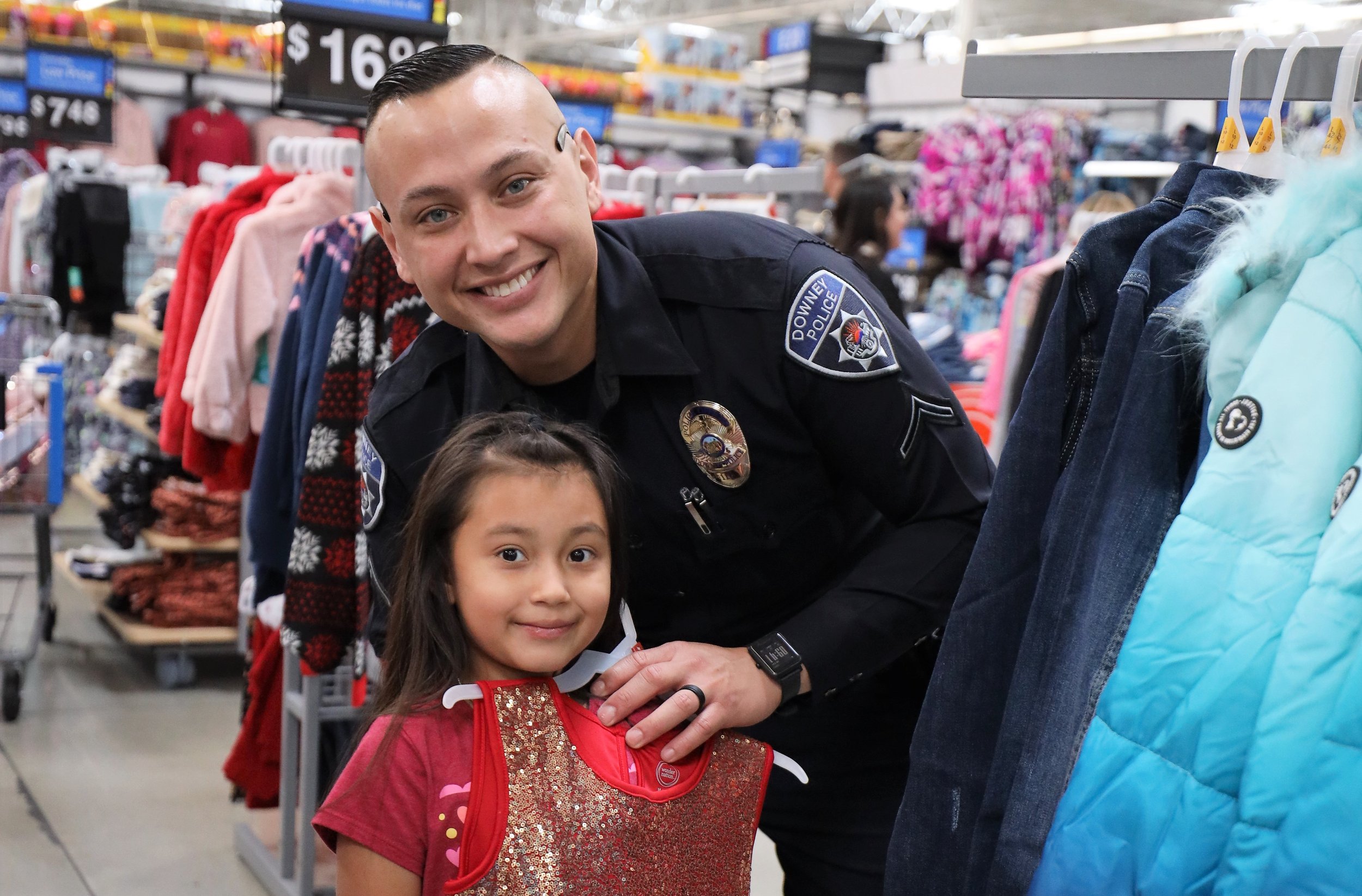 Downey police officers take 20 families holiday shopping
