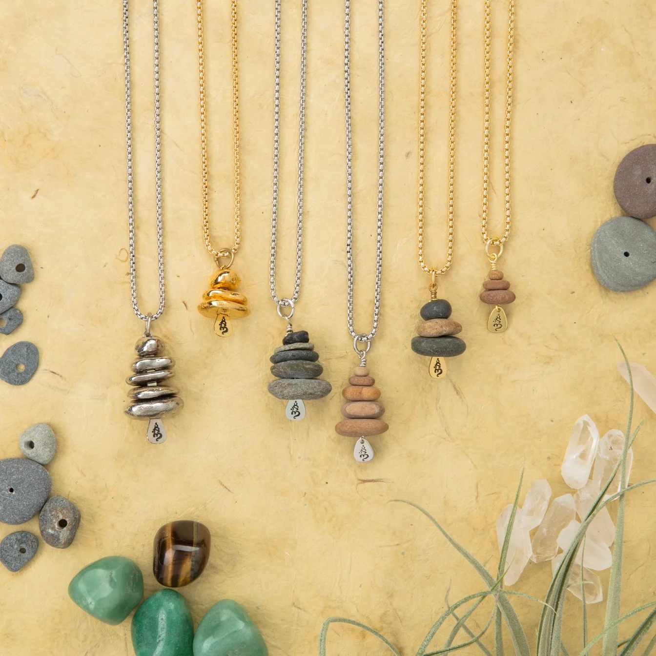 stone stack jewelry The syllable Om is a mantra and incantation that represents the primordial sound, the resonance of the universe. Fittingly, OMstacks are created with stone, the ancient stuff of the world. To chant Om is to put body and spirit in sync with the cosmos. To wear it is to gain balance and good fortune in your journey.