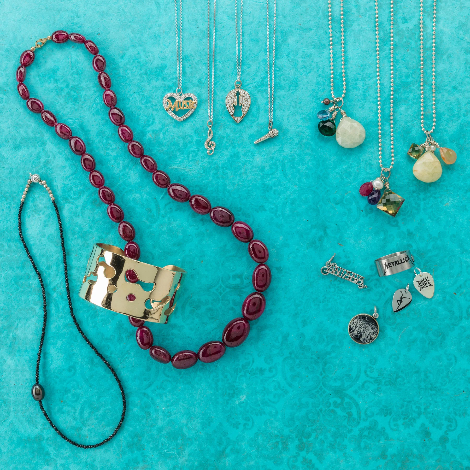 custom merchandise Some clients have specific needs—personalized charms, one-of-a-kind commissions, a line of merchandise for an artist. Using materials ranging from precious metals to recycled trash, Garrison matches ordering, pricing and manufacturing for a customer’s vision to execute any project.