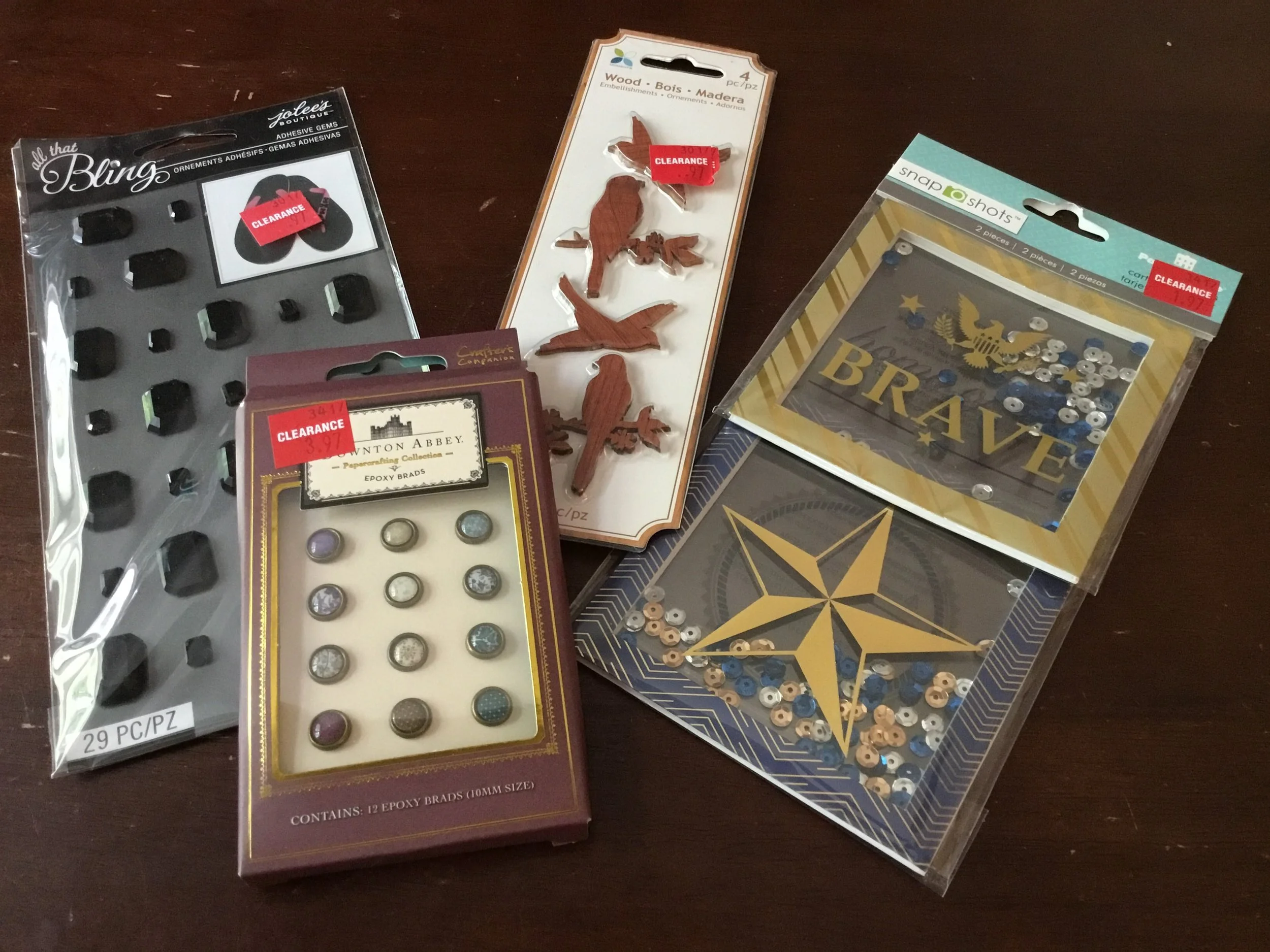 Black adhesive brads by Jolee's Boutique, Downton Abbey inspired brads by Crafter's Companion, wooden bird embellishments by Momenta and patriotic shaker boxes by Paper House Productions