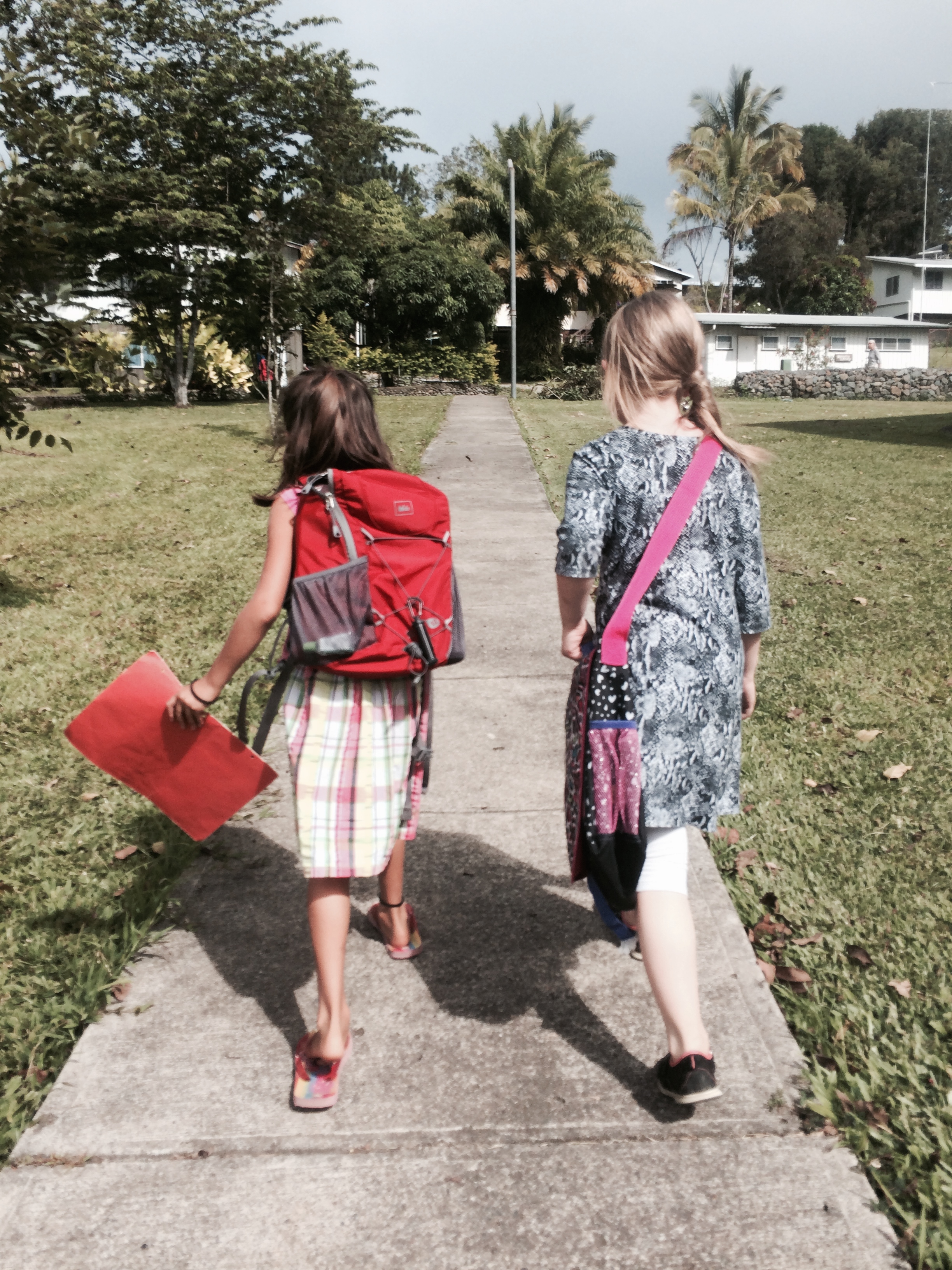 Walking home from school with one of her new friends/classmates (Small world - we know this little girl's grandparents in the midwest!)