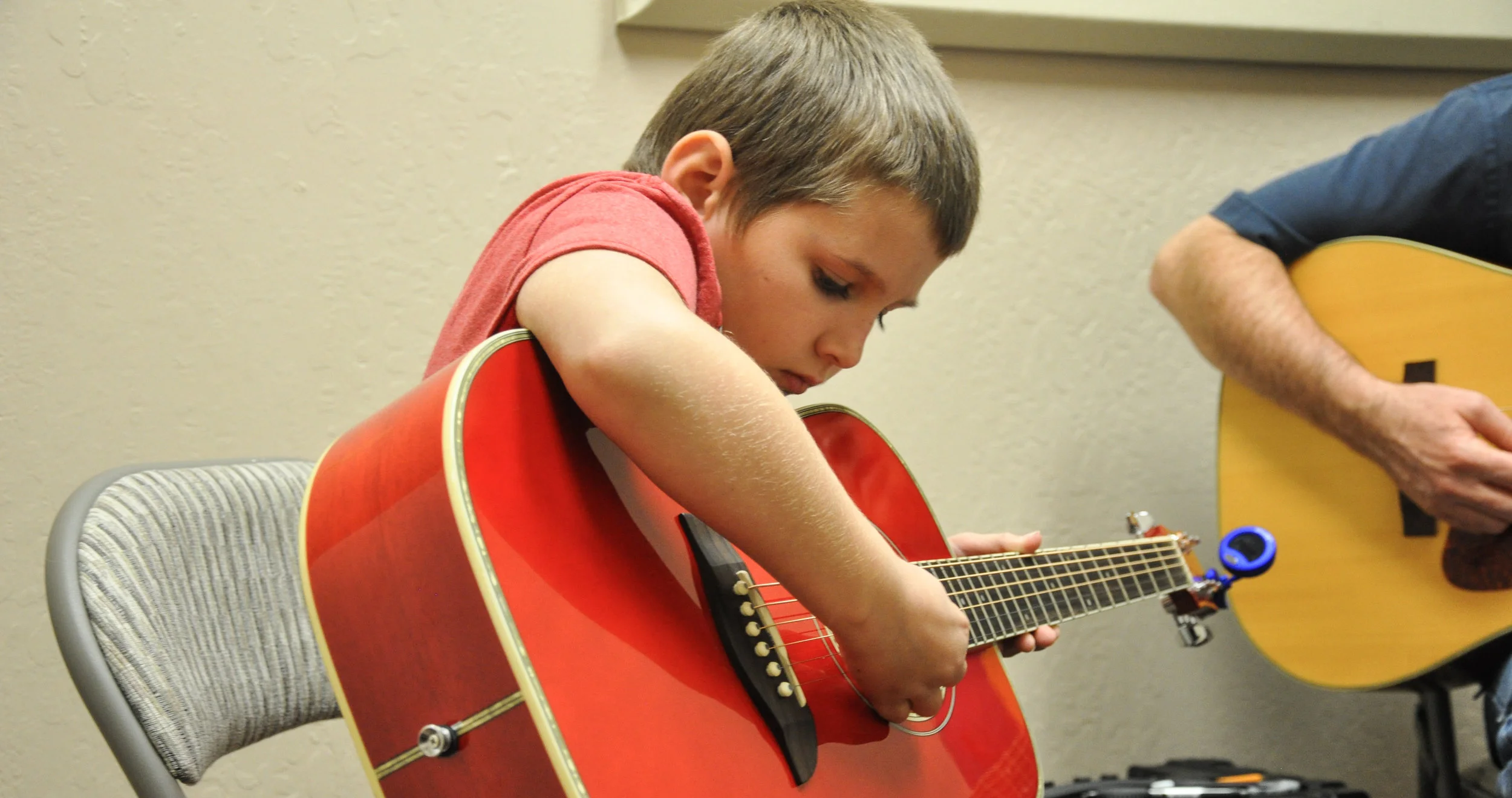 Samy with guitar.jpg