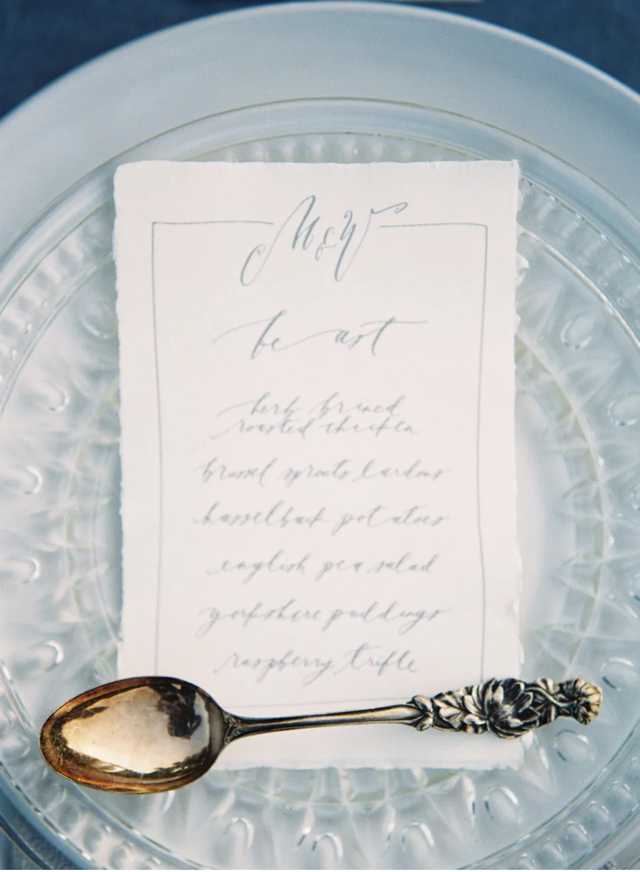 18. Classic blues give a nod to elegant country styling with calligraphy by Brown Linen Design and photography by Heather Payne Photography for the Team Flower Workshop . View more from this shoot here on Vale + Vine.