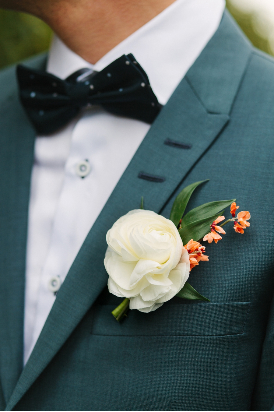 Grooms-Bowtie-and-Ranunculus-Boutinniere