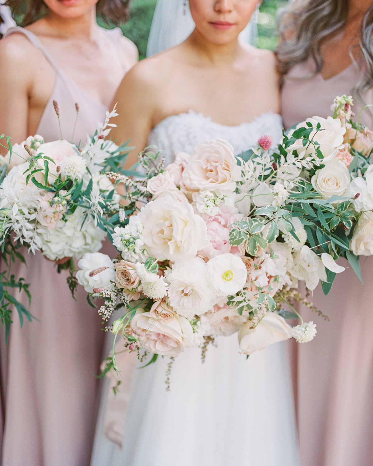 Bridesmaids bouquets in blush
