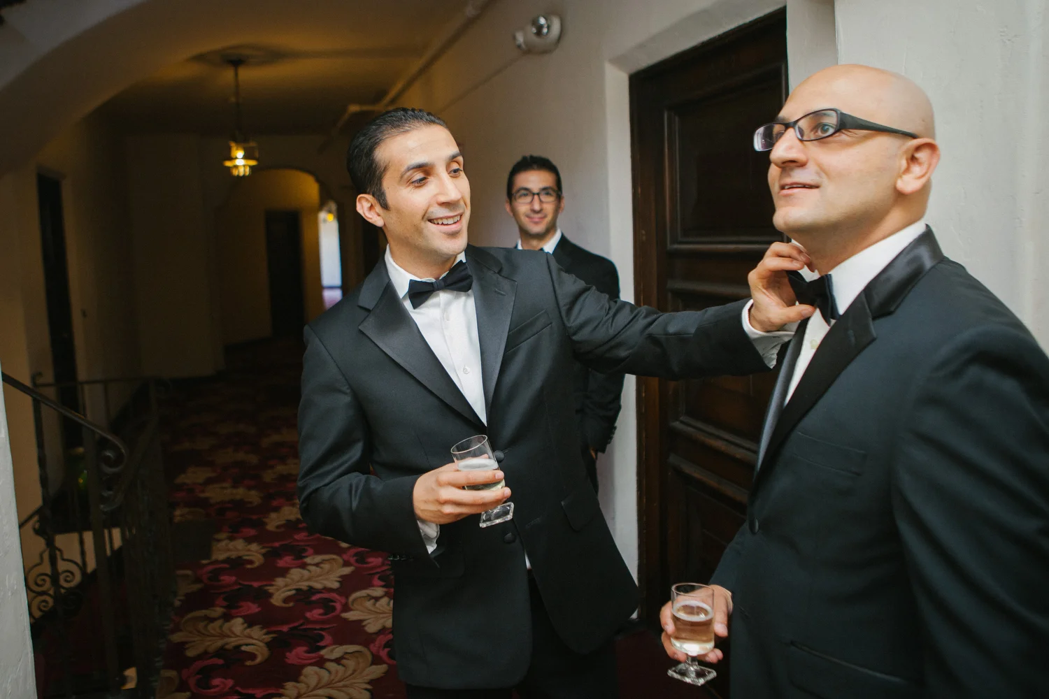 Groomsmen adjust their ties in Oakland, Calif. 