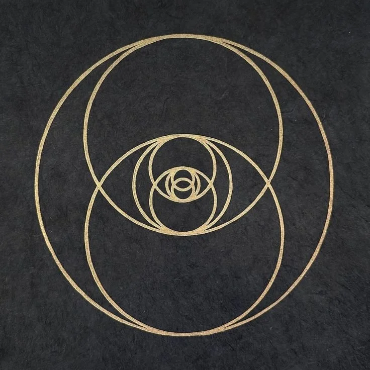 Golden geometric pattern of overlapping circles on black background.
