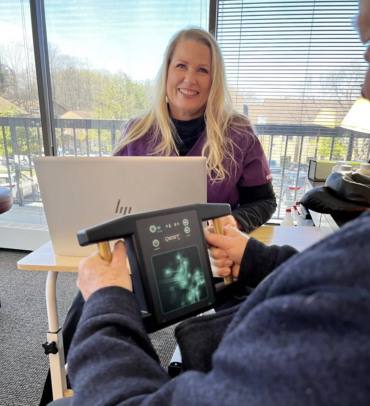 Melody Thomas with Qest4 BioEnergetics Client