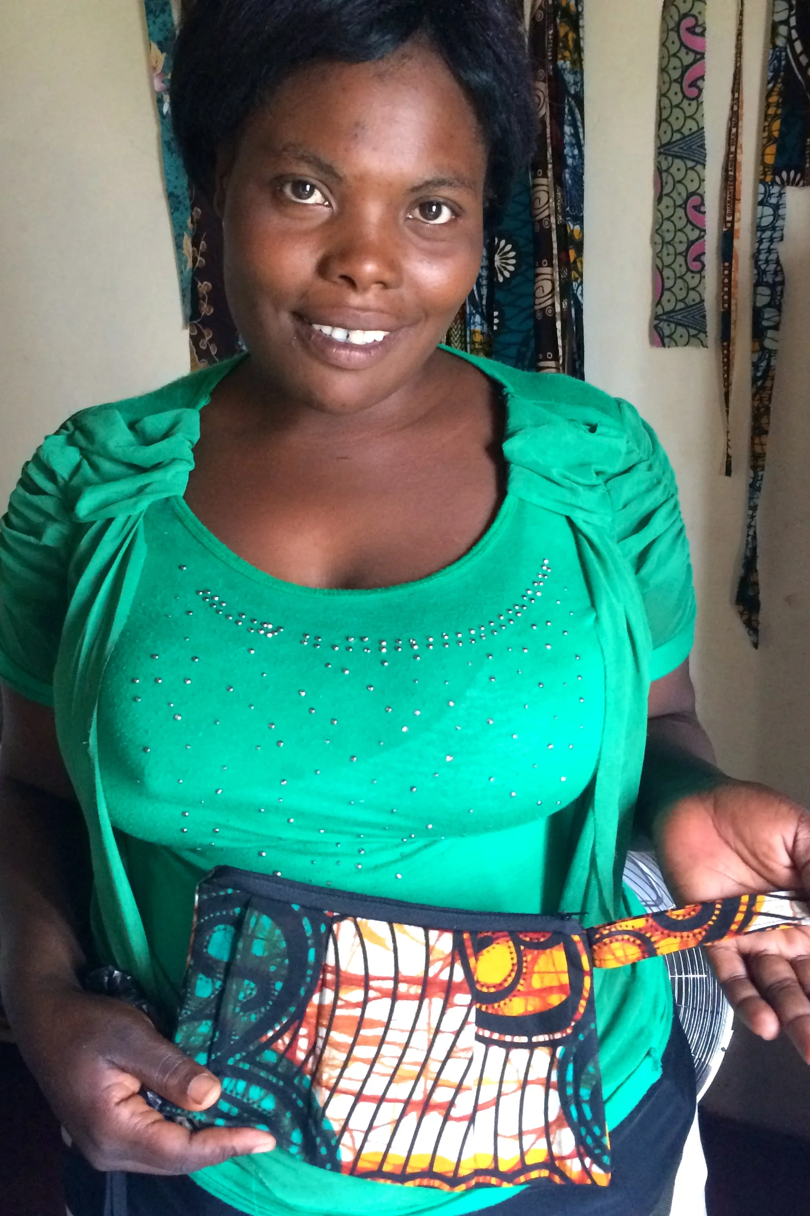 Patriciar with a her clutch design for the Fall 2015 Collection
