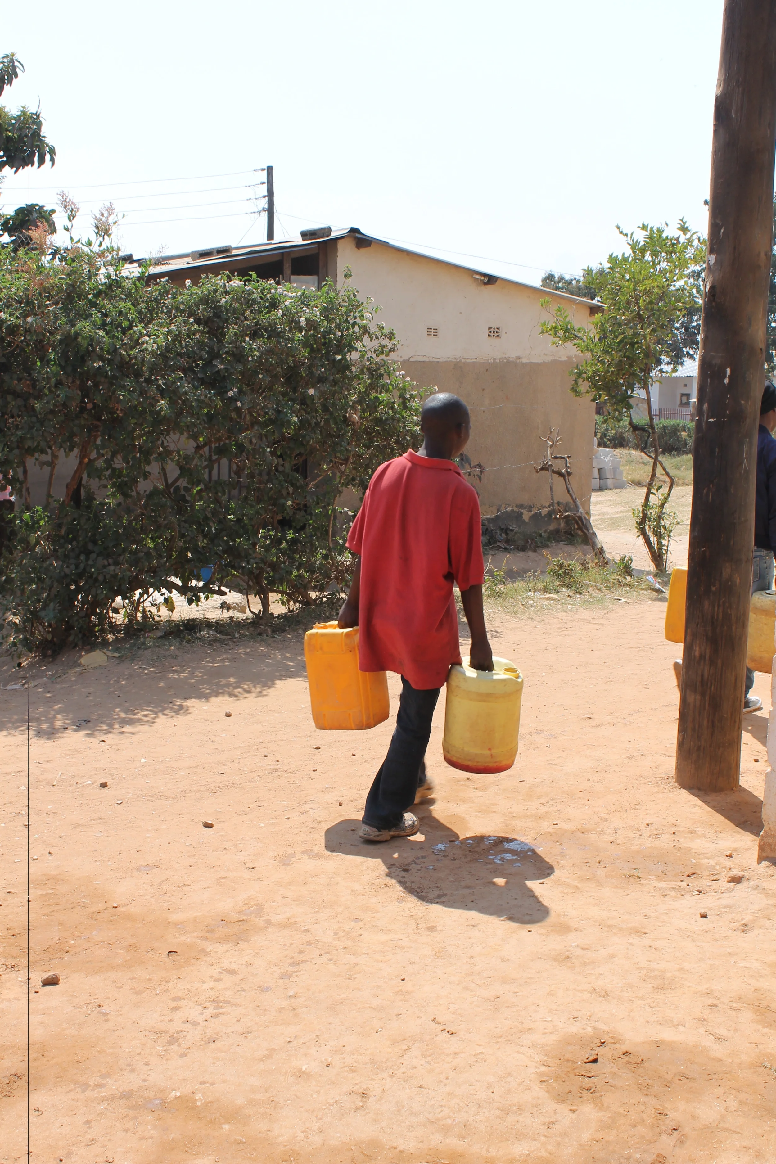 These water jugs mean life for households without running water. We love watching individuals walk away with full buckets, knowing the difference that water will make for entire families. 