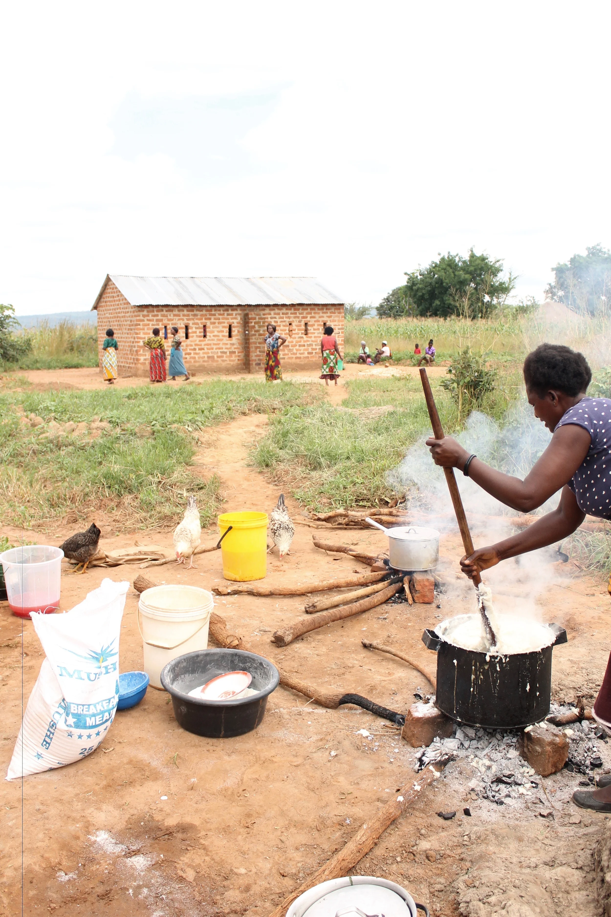 Cecelia, now a graduate of the Village group, prepared a HUGE pot of nshima for all 30+ of us to enjoy for our holiday feast! This took her around 2 hours to prepare, using trees as firewood. 