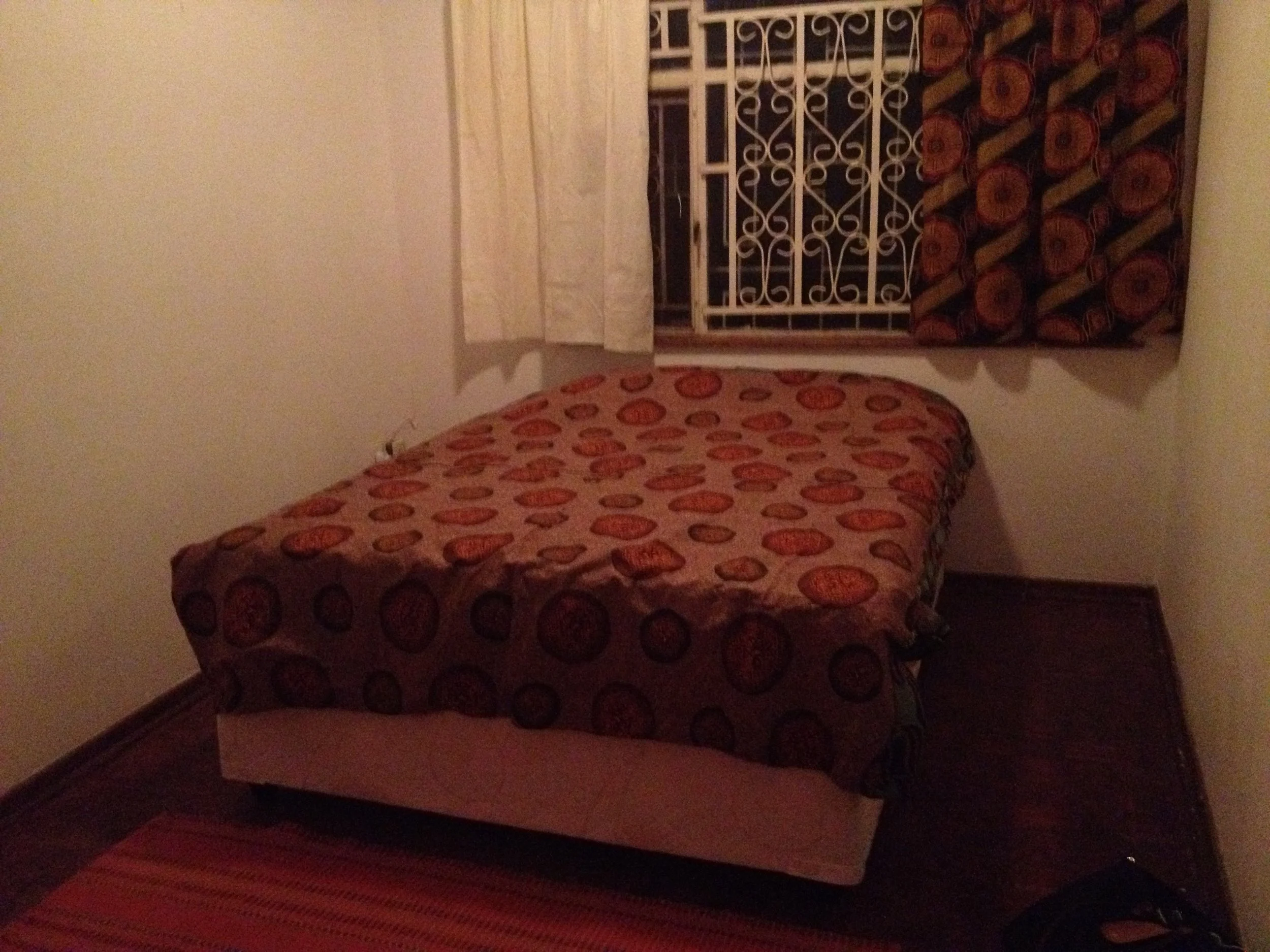My new bedroom, complete with makeshift curtains from extra muslin fabric and a chitenge I bought on the side of the road. Nonprofit budgets are real, folks.