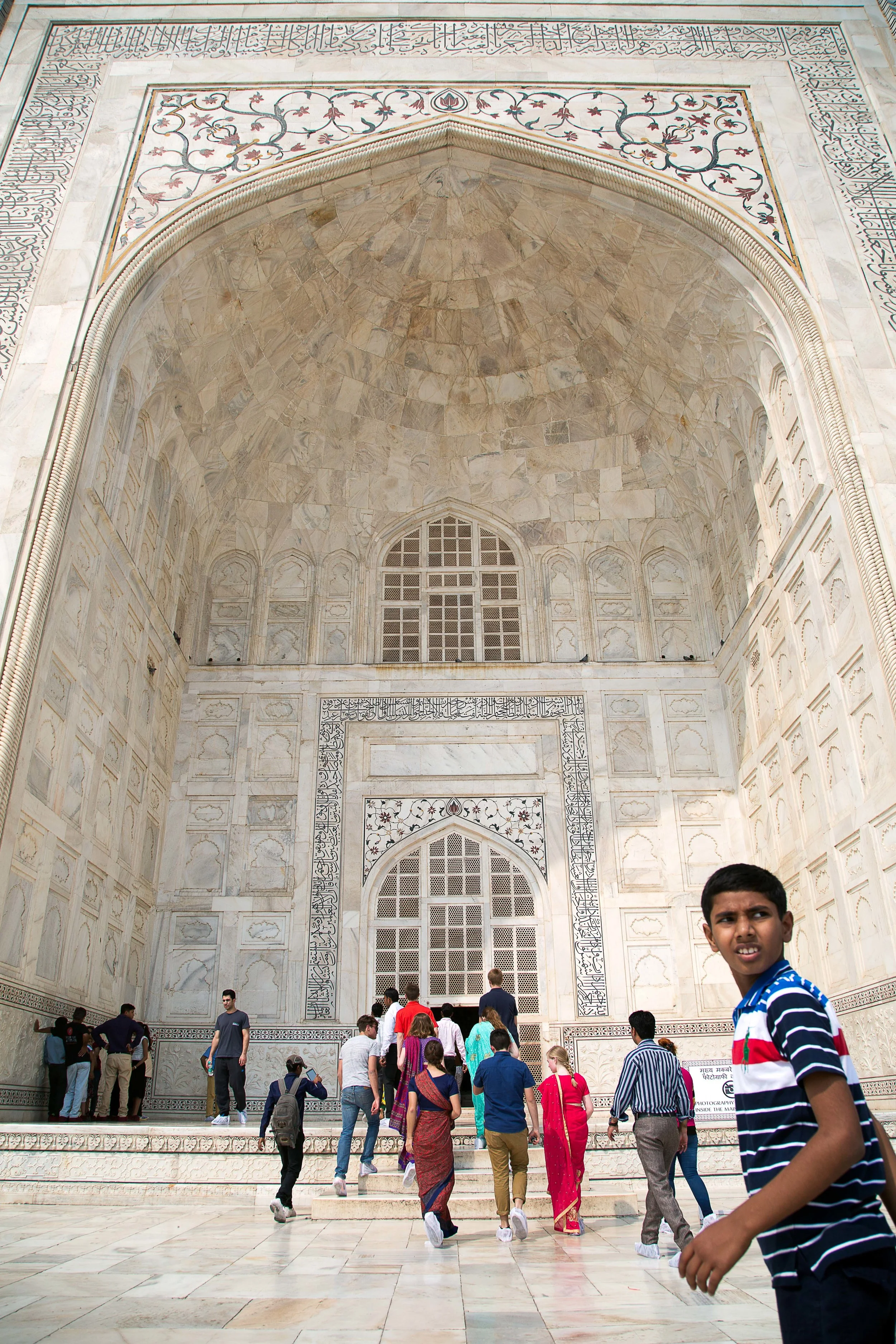 A boy looks back before entering the Taj Mahal in Agra, India.