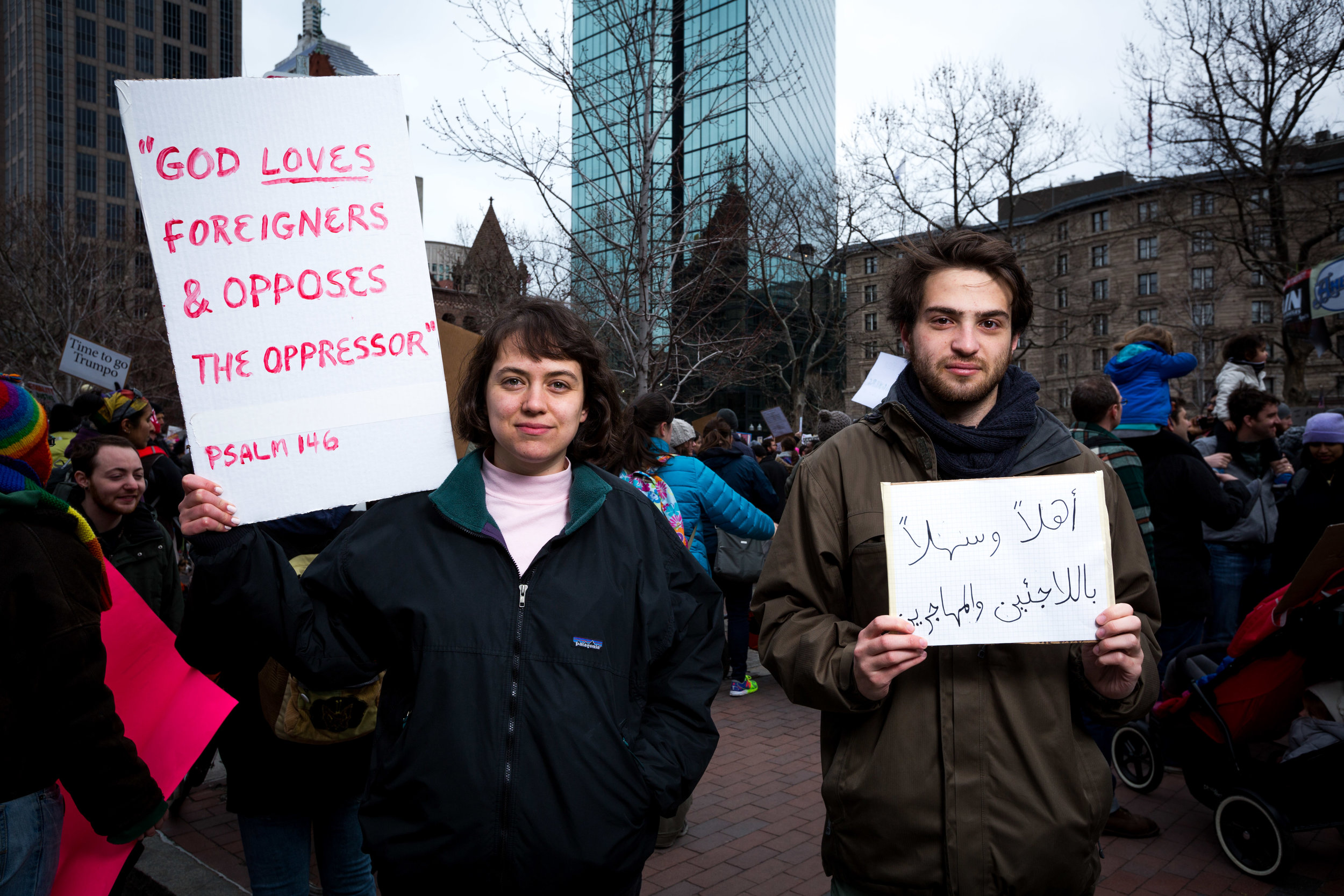 MADELINE & BEN M: “I’m feeling angry and sad.” B: “I hope this sends a message to the government that Immigrants and Refugees are vital to our country.” Ben’s sign says: “Refugees and Immigrants are welcome.” (Written in Arabic)