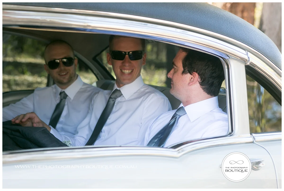 groom and best man in limo
