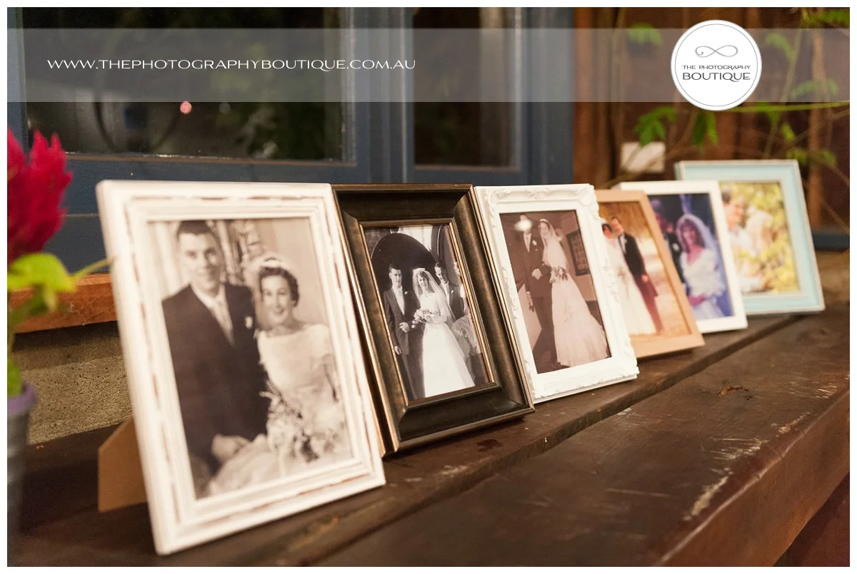 picture frames of family and grandparents as wedding styling