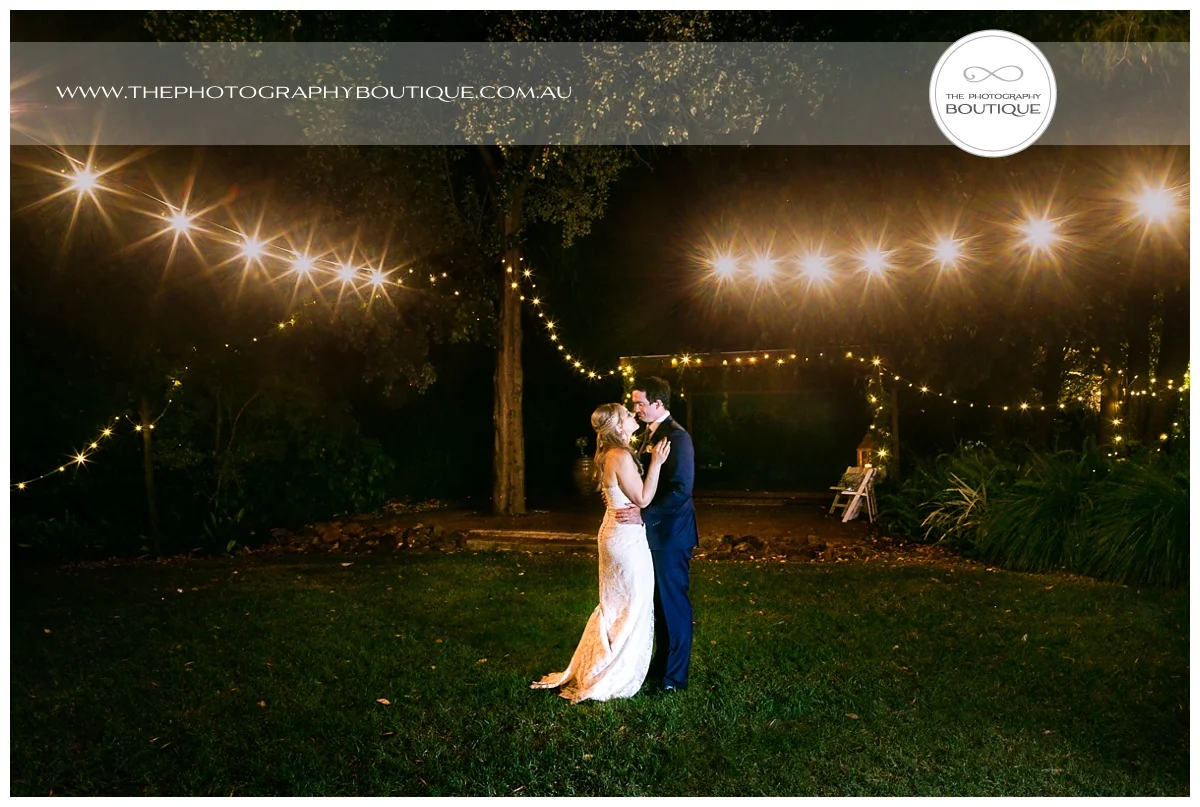bride and groom dancing under string lanterns at chandeliers on abbey margaret river