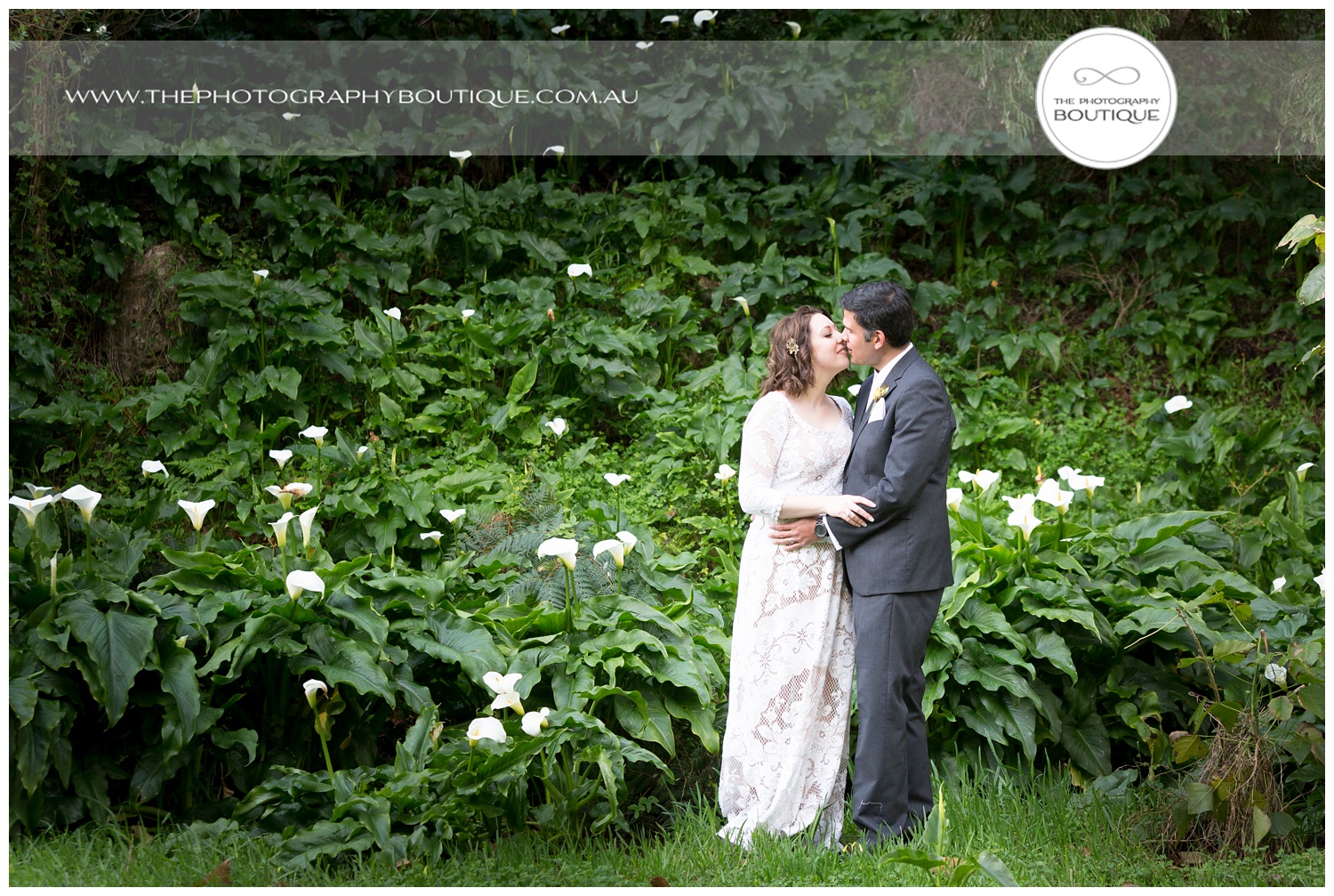 Bride and groom in the lillies at Caves House Yallingup