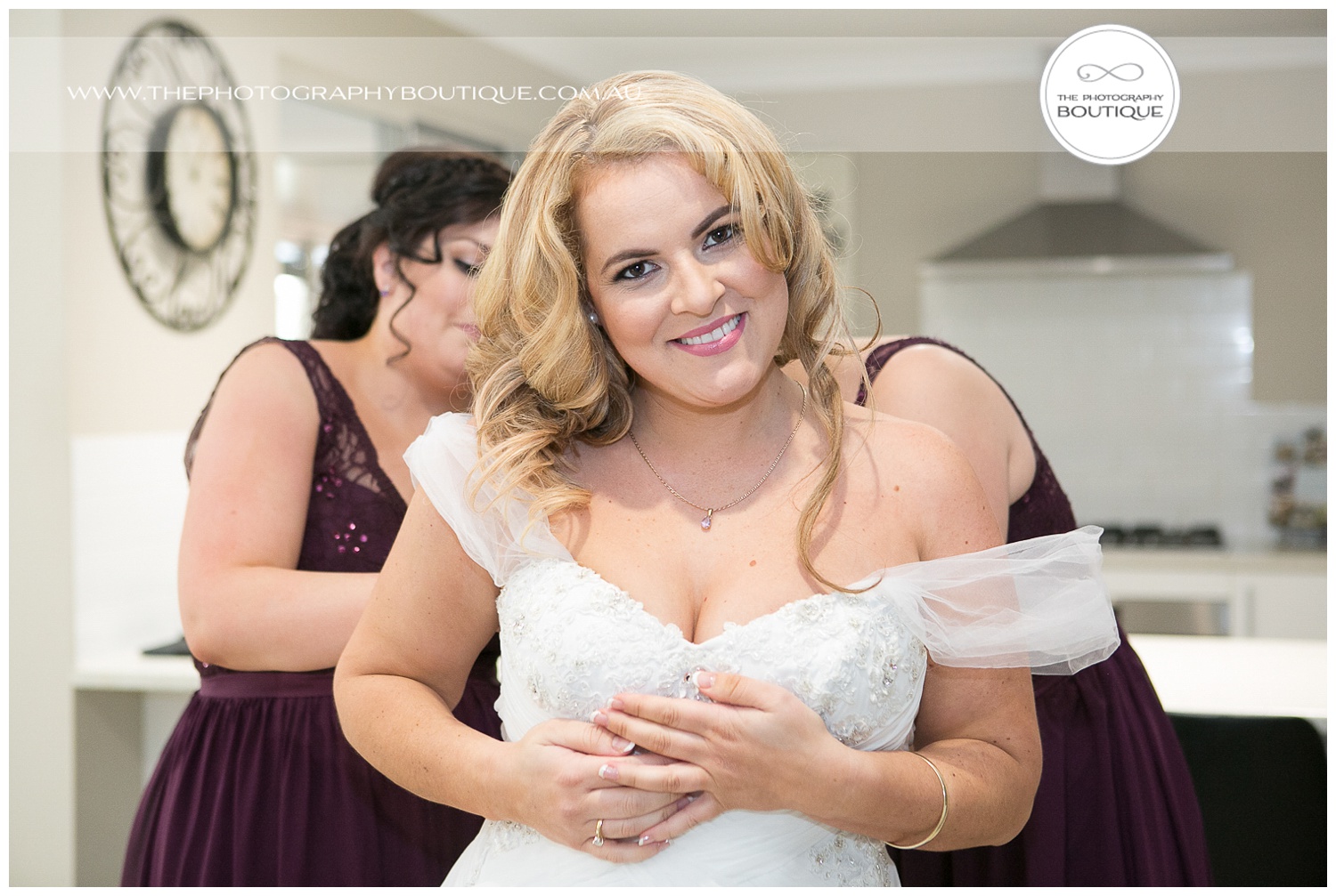bride getting into her dress at roelands backyard wedding