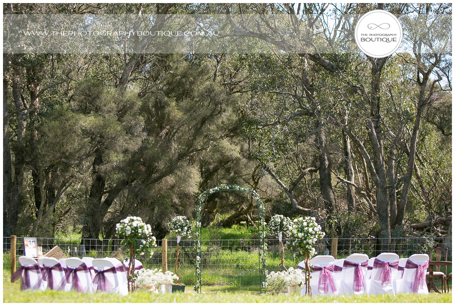 Backyard ceremony garden setup with whites and purples