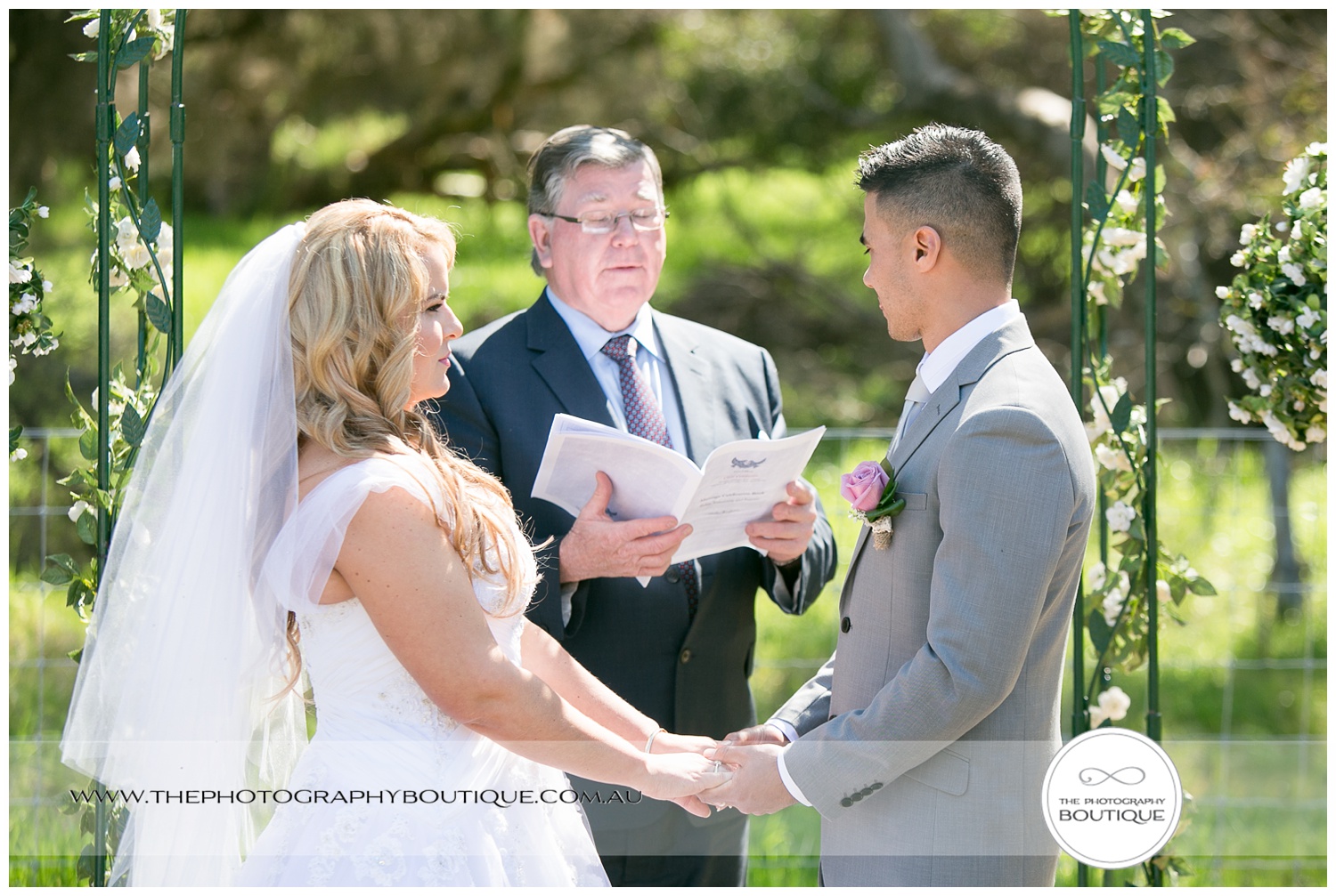 bride and groom holding hands at roelands backyard wedding