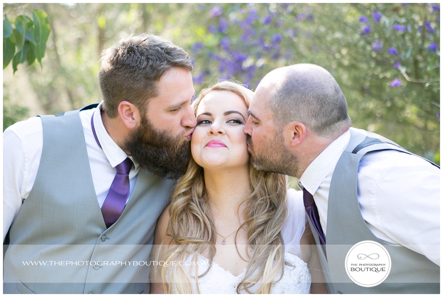 Groomsmen kissing the bride at Roelands Bunbury wedding