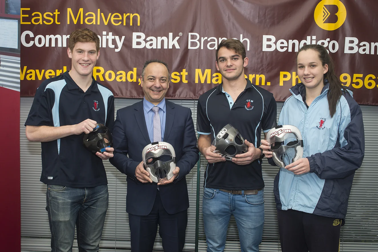 TEM Players Braden Pitcher, Will Harty & Bronte Hough pose with the masks alongside Branch Manager George Prodromidis