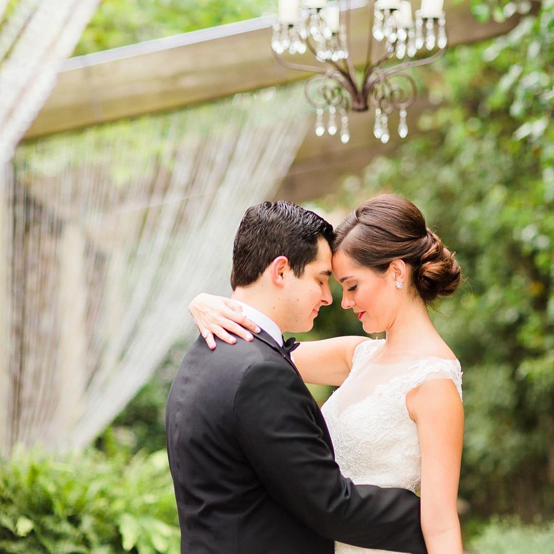 Bride and Groom Embrace in Candela Courtyard.jpg