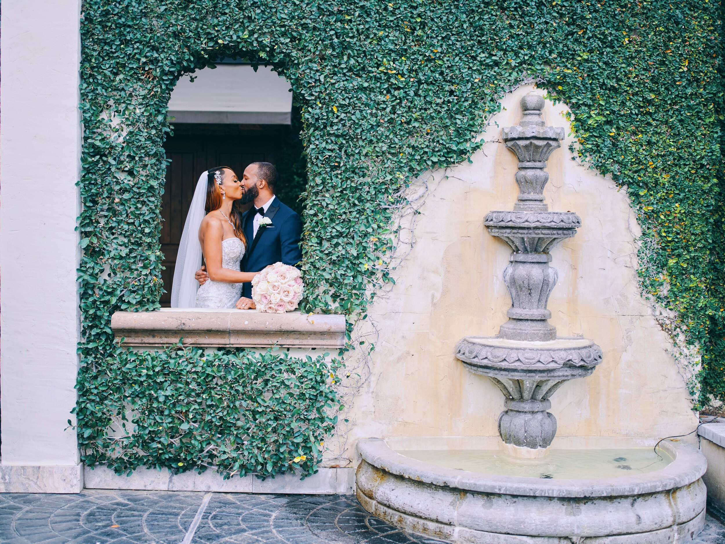 A kissing couple at a Wedding Event near downtown Houston.