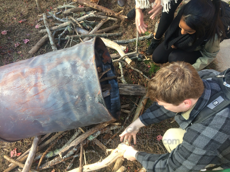 Students select the wood for the inner barrel of the retort