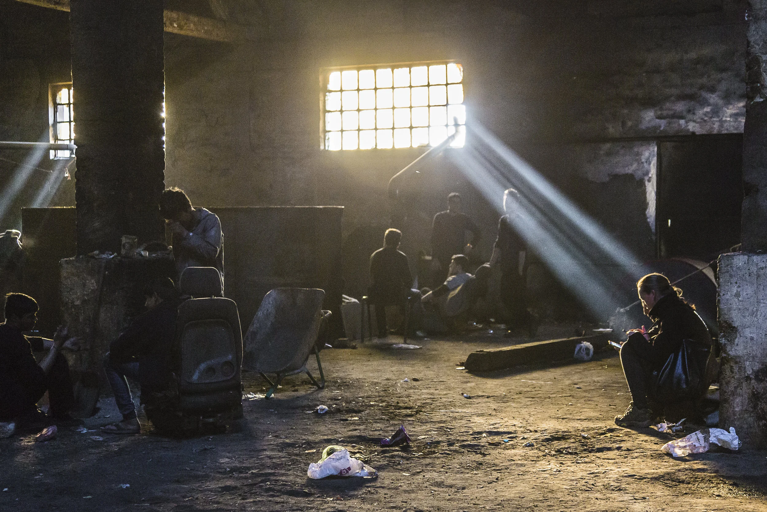 The ruined barracks were the refugees have spent the winter, sleeping in the dirt and cooking and heating with coal stoves.