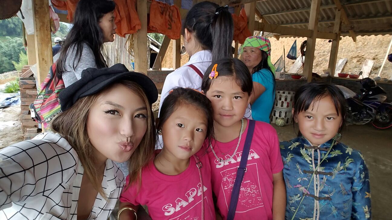The mom is in the green headband, Ngu is in the white shirt and ponytail and the rest of the girls are her family.