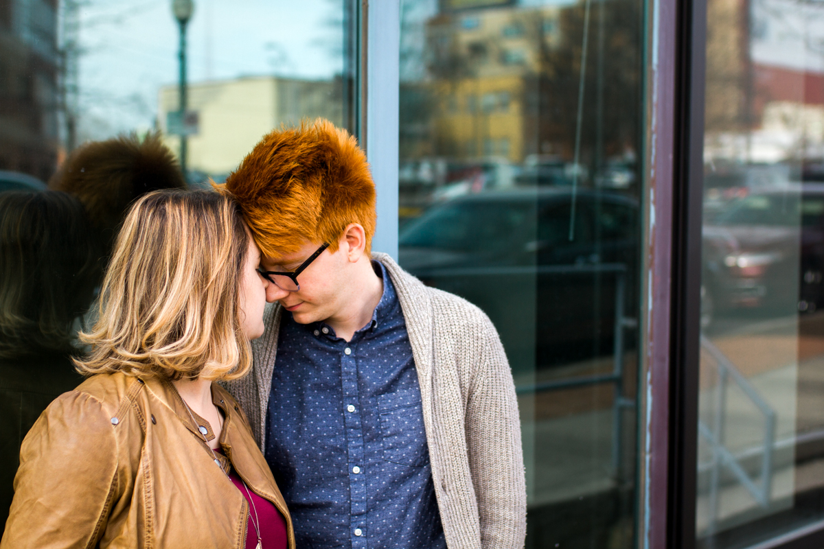  urban engaged or married couple reflected in a window engagment photography couples photography Westport Kansas City, MO 