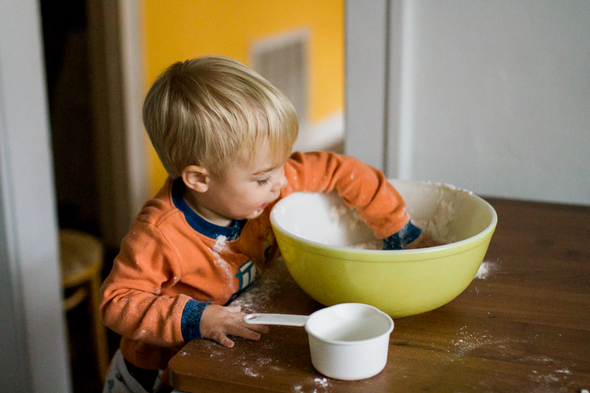 Kansas City, MO lifestyle family photographer boy cooking with mom family photography