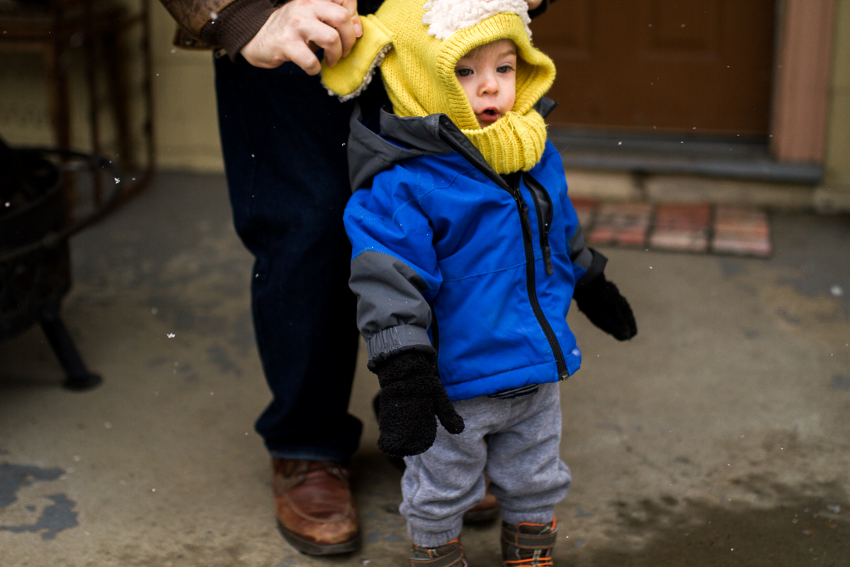  Kansas City, MO lifestyle family photographer father and son in the snow winter family photography 