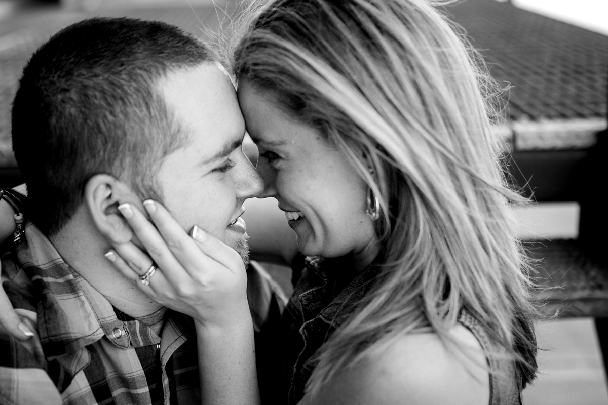  Couples session in Kansas City west bottoms couples photography couple sitting on stairs about to kiss black and white photo 