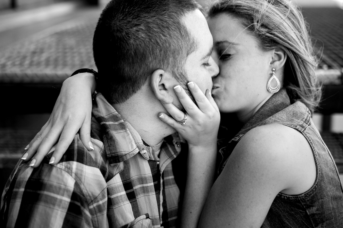  Couples session in Kansas City west bottoms couples photography couple sitting on stairs kissing black and white photo 